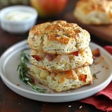 A stack of biscuits with a bowl of butter.